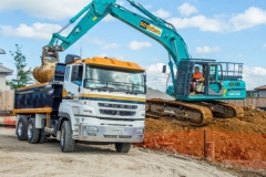 Scarbro Civil Contractors Excavator Loading Truck