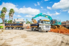 Scarbro Civil Contractors Excavator Loading Truck